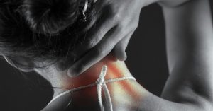 Woman holding her neck in discomfort, illustrating joint comfort and inflammation